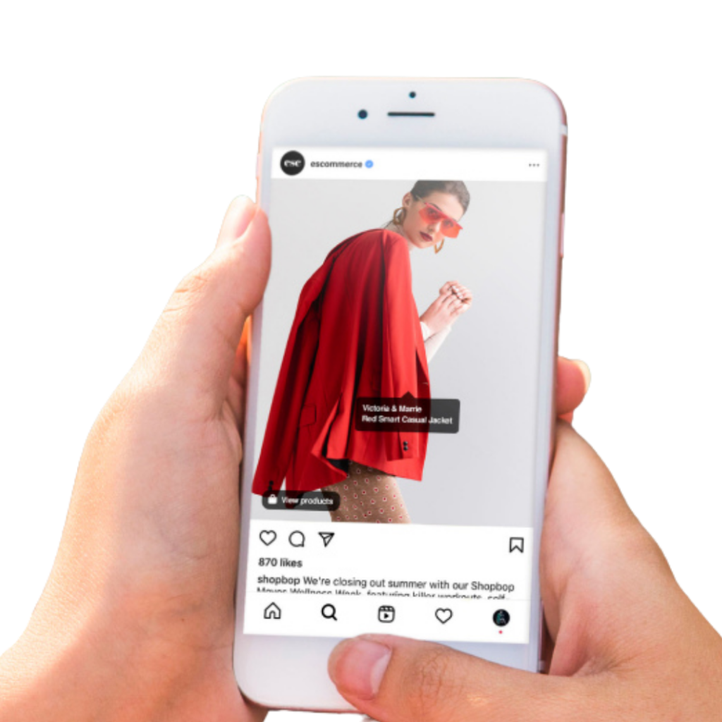 A person holding a phone with both hands. On the screen is a woman wearing a red coat