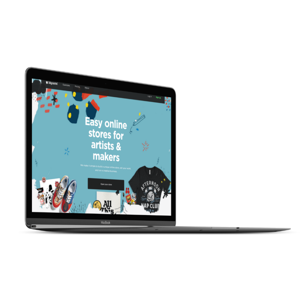 A laptop with the BigCartel homepage on the screen